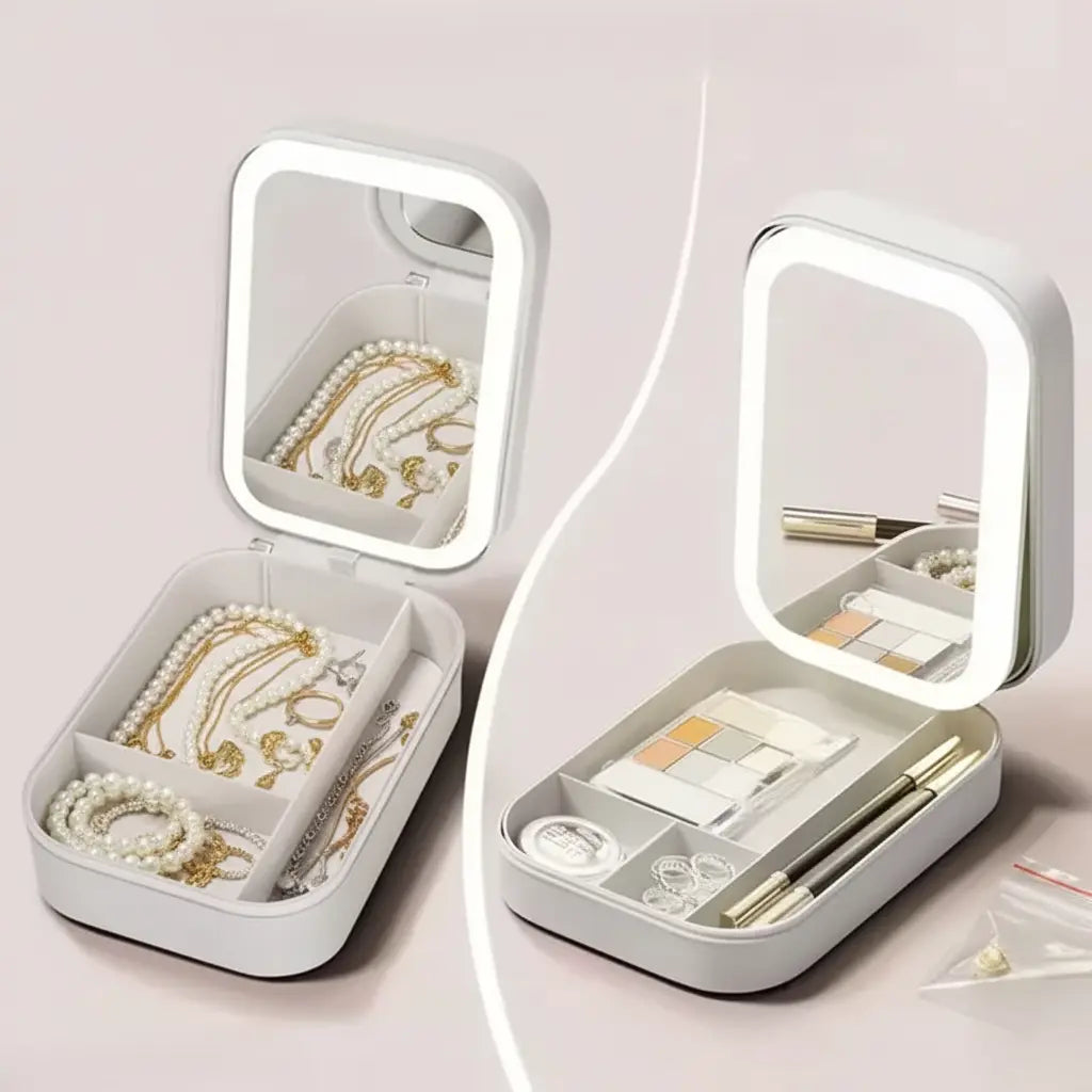 White jewelry and makeup organizer with LED light on a pink background